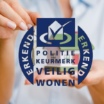 Politie Keurmerk Veilig Wonen logo met sleutel en huis als symbool voor erkende woningbeveiliging in Nederland